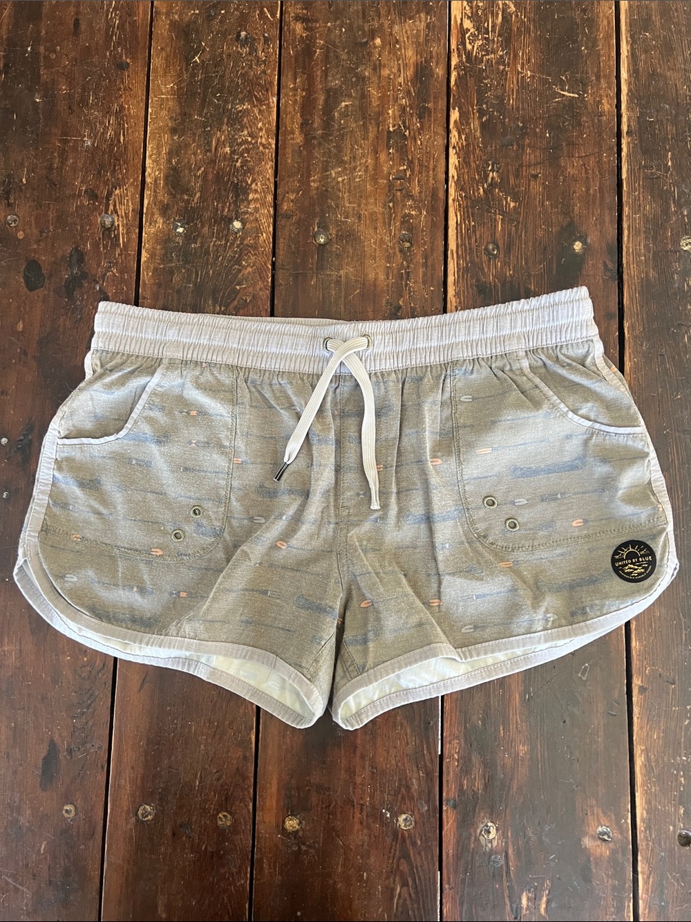 United By Blue Athletic Drawstring Shorts with rustic canoe/paddle/lake design